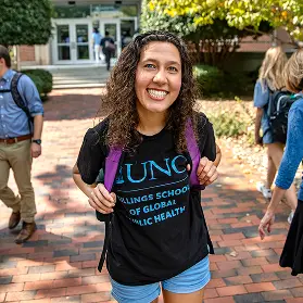 Smiling student standing in the Pit